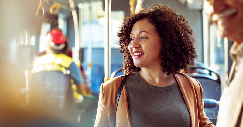 Woman smiling while on public transport