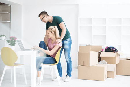Couple with moving boxes
