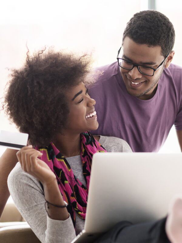 Young couple completing background checks online