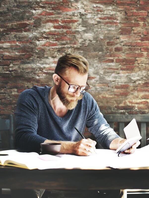 Man in glasses aggregating data