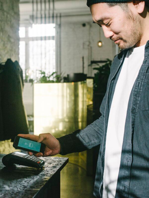 Man making a purchase in a store