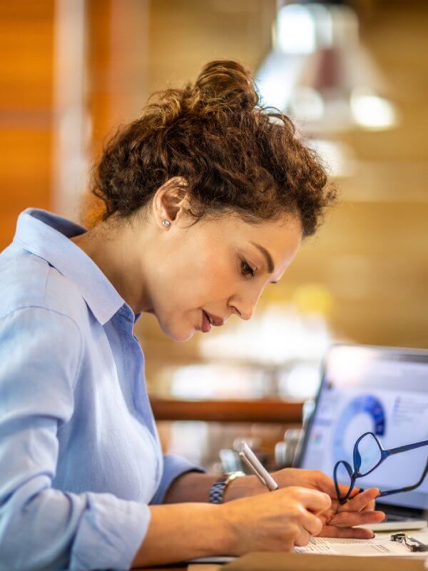 Woman in an office checking her company against privacy guidelines