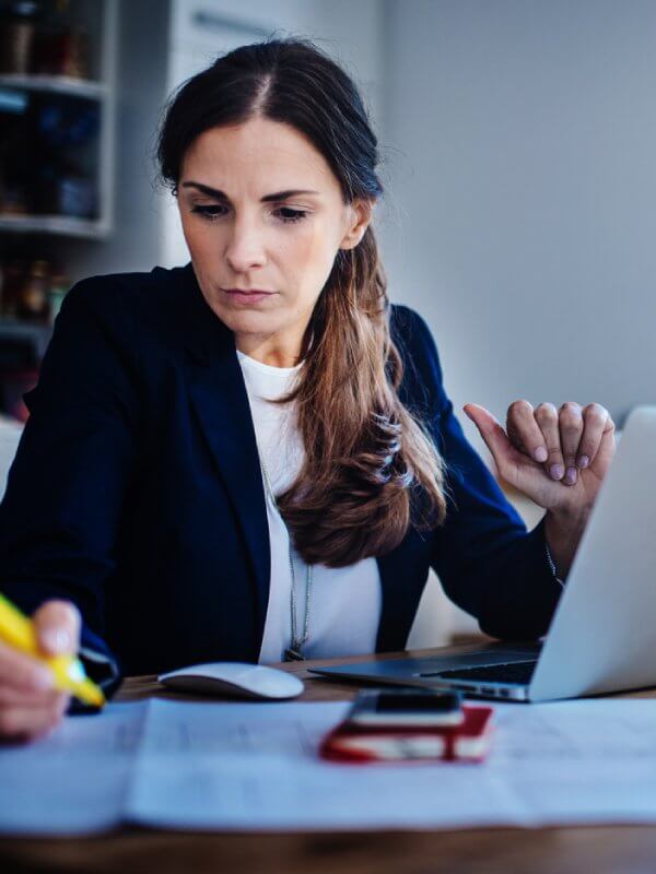 Woman looking over data in the office
