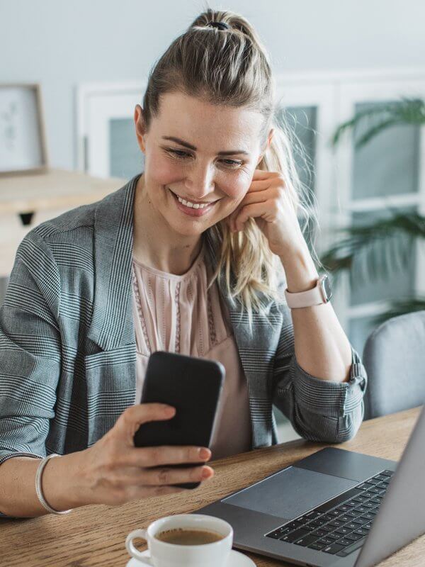 Woman looking at phone at home