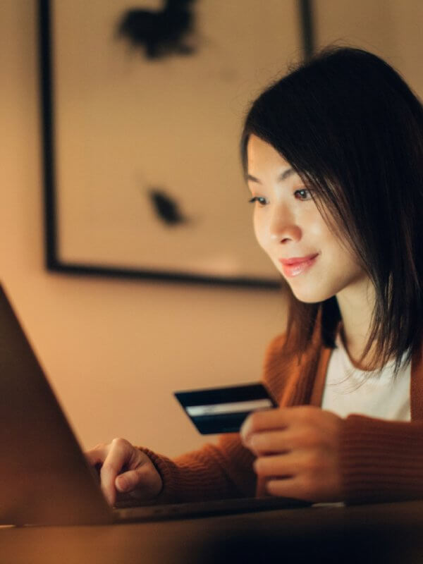 Woman paying online for purchases