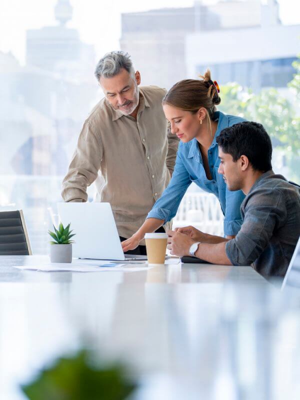 Colleagues in an office looking at marketing data